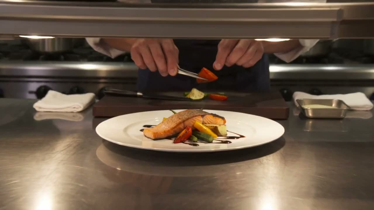 A chef plating salmon, then a close-up of the finished plate