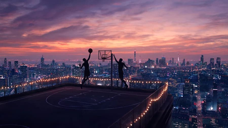 A wide dusk scene generated with Seedream 5 — two players mid-jump on a rooftop basketball court, silhouetted against a purple and orange sky over a glowing city.